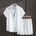Men's black cotton blend short sleeve shirt and shorts casual summer suit on a hanger.
