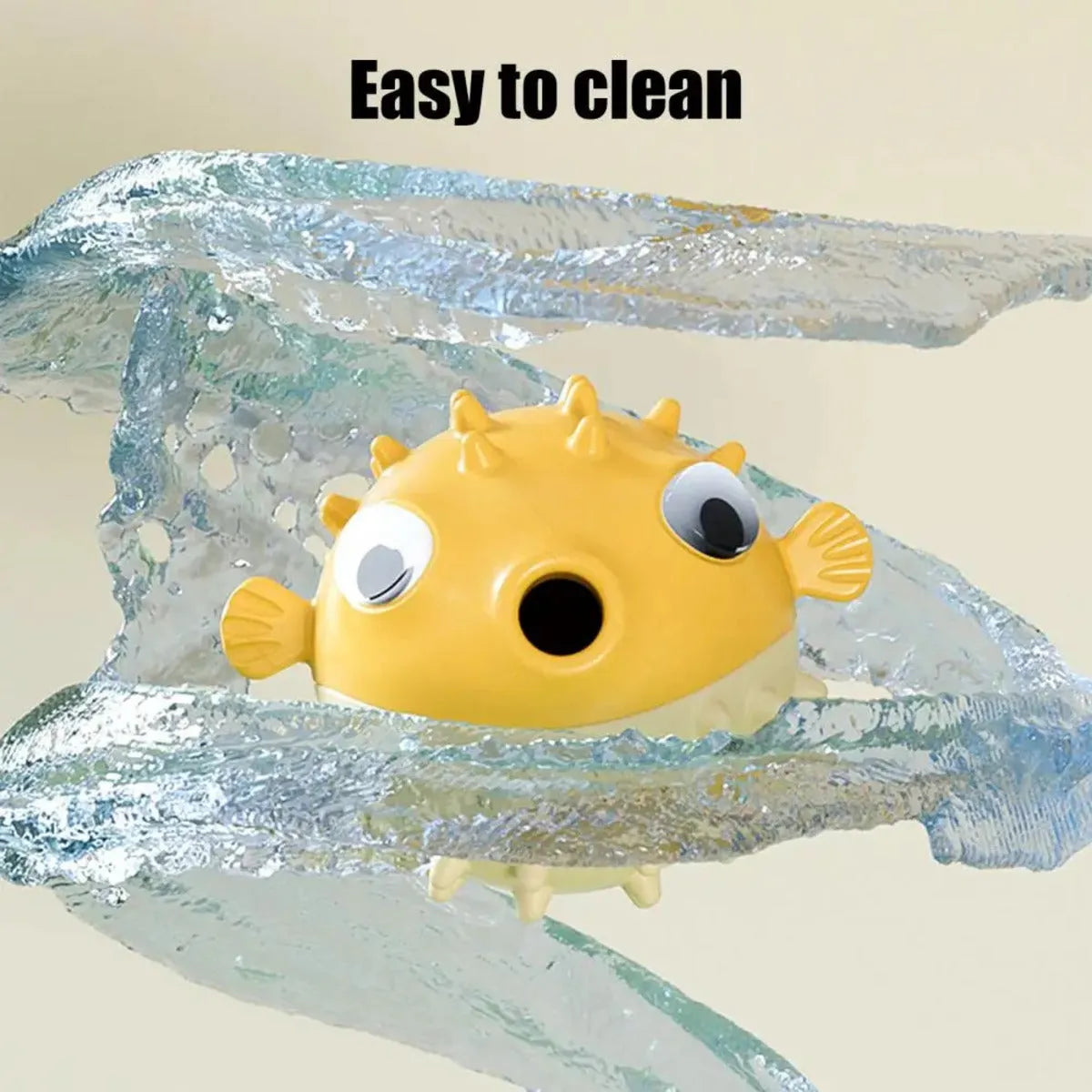 Yellow fish-shaped vinyl dog chew toy with textured surface and squeaker.