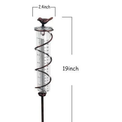Cast iron and glass outdoor rain gauge with hummingbird design showing 0-800ml capacity
