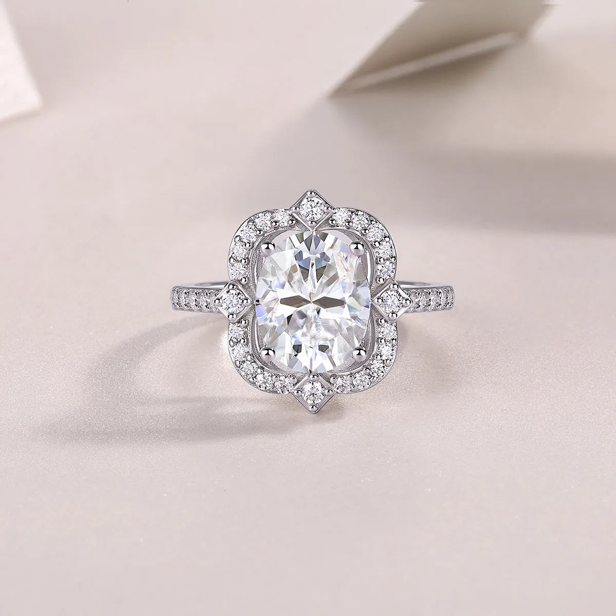Camellia moissanite wedding ring with egg-shaped 8x10mm stone in S925 silver platinum-plated setting