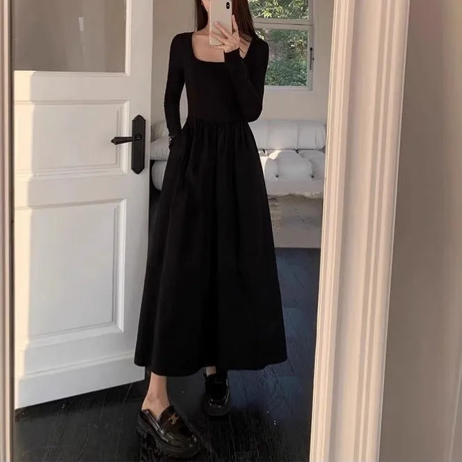 Women's black square collar knitted dress with long sleeves and an elastic A-line waist.