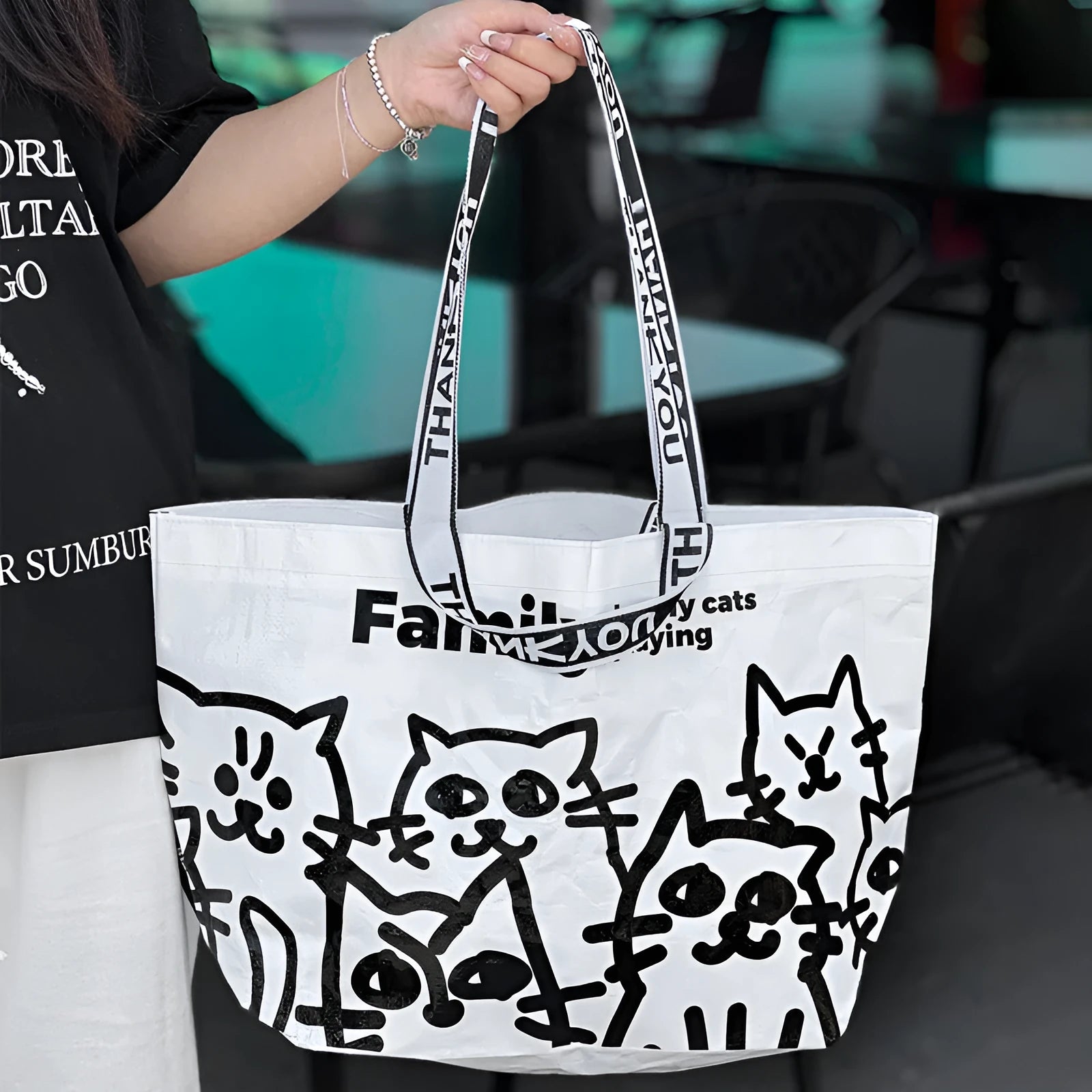 Green PP woven waterproof handbag with snakeskin pattern printing, shown as a crossbody shoulder bag.