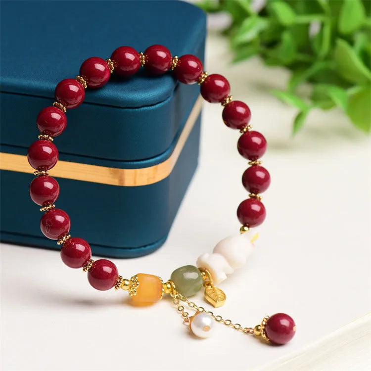 Natural cinnabar rabbit charm bracelet in Chinese national style, available in 8mm or 10mm diameters