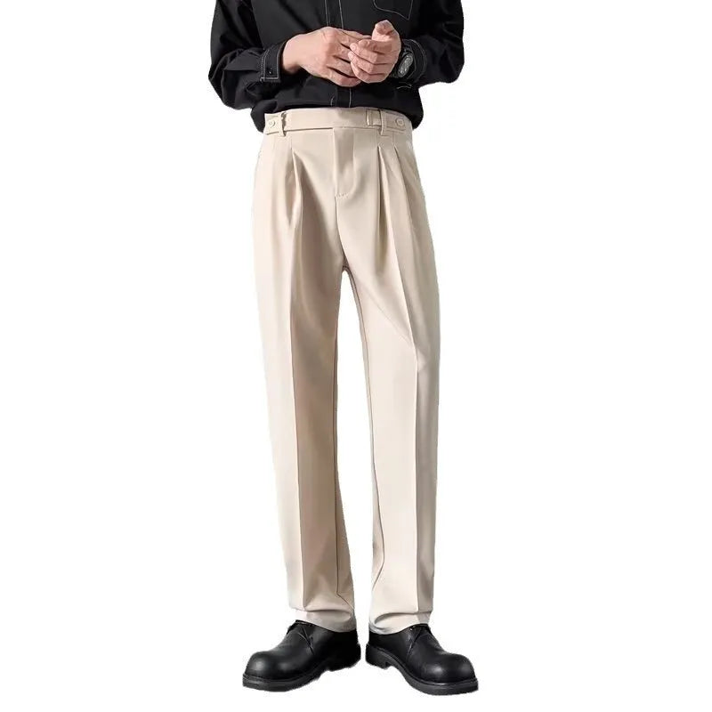 Men's apricot and black straight-leg loose-fit suit trousers on a hanger.