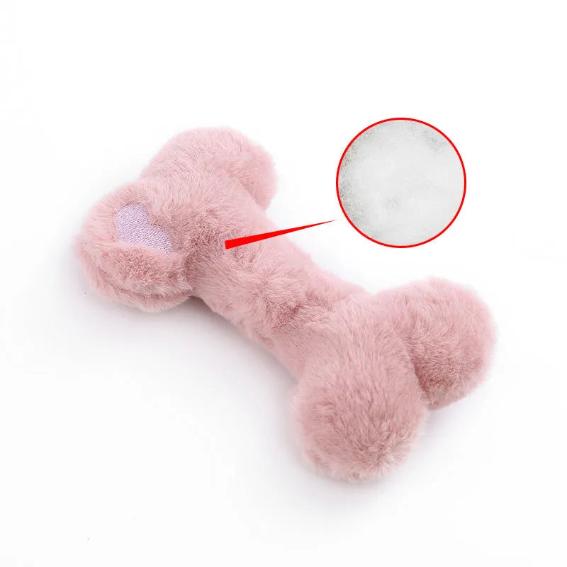 Blue plush bone dog toy with squeaker on a plain background.