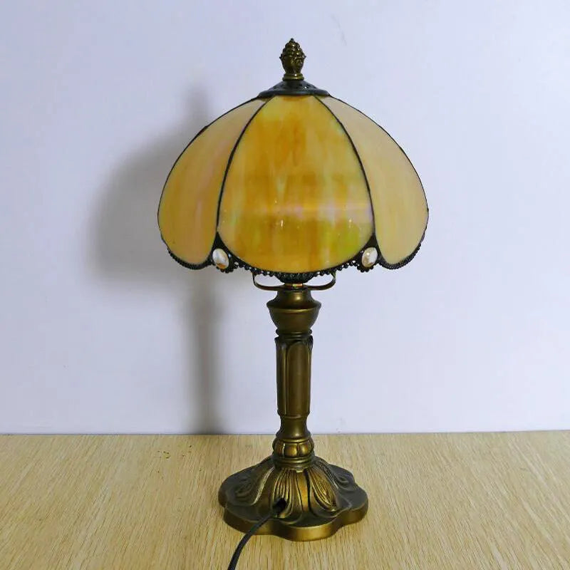 Beige simple modern creative art bedside lamp 20cm width on a bedside table