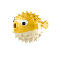 Green fish-shaped interactive dog toy with textured surface for dental cleaning