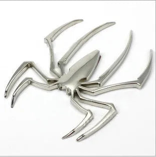 Zinc alloy 3D spider bumper sticker in metallic colours on a car bumper.