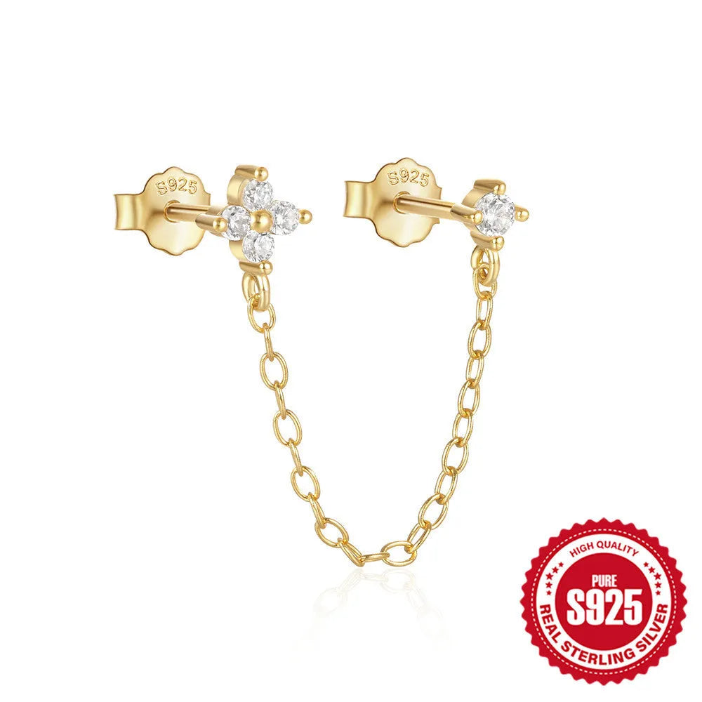 Golden tone sterling silver ear clip studs with a geometric flower, tassel, and chain design.