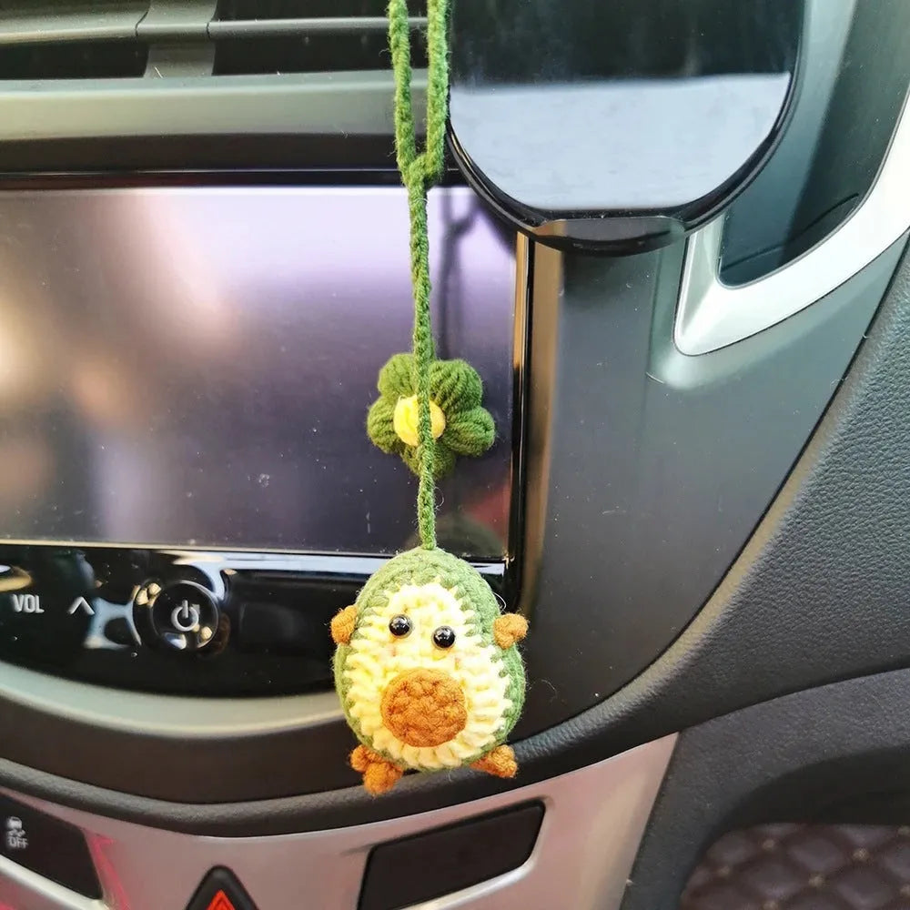 Handmade wool crocheted car pendant in avocado, pink rainbow, and red rainbow colour options