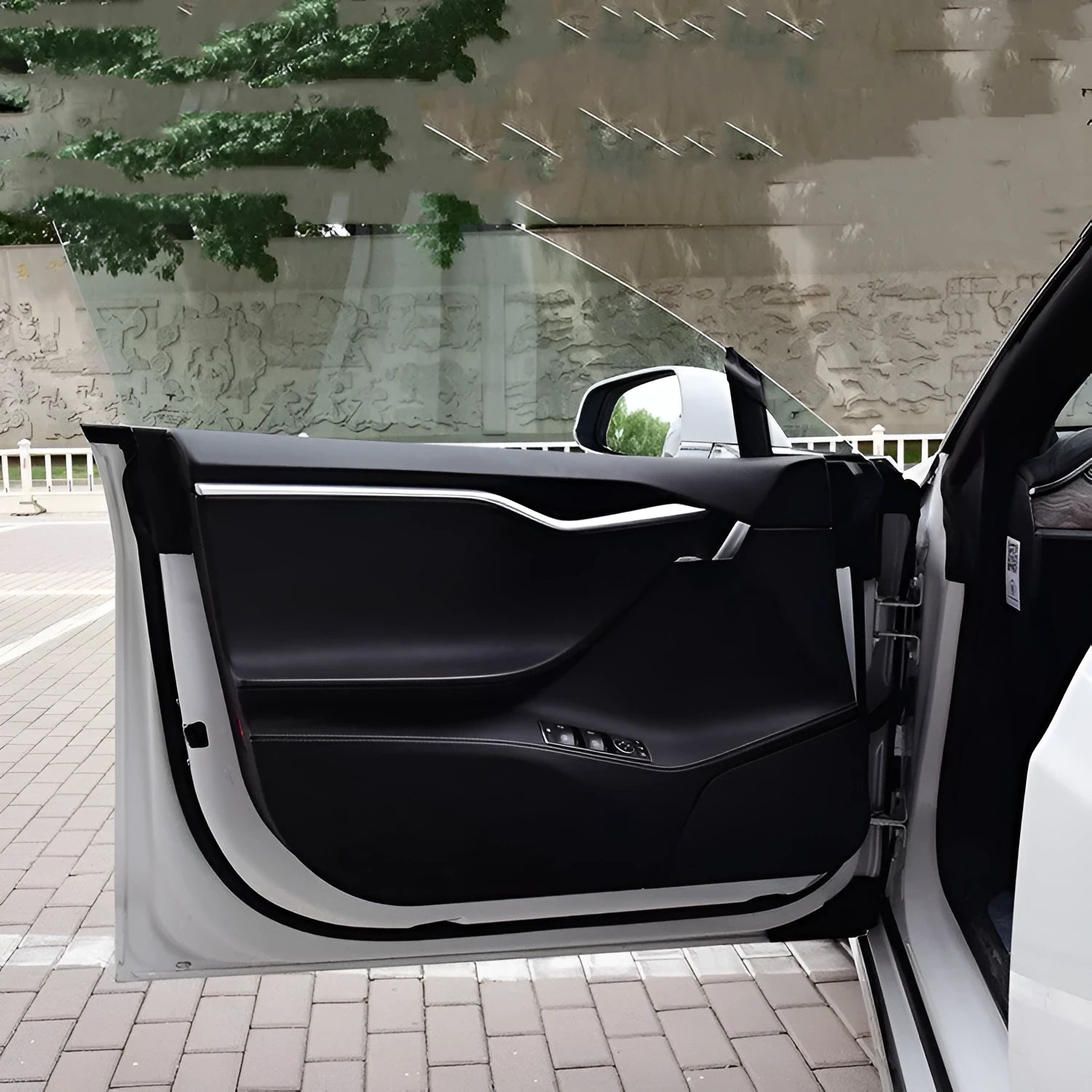 Four pre-cut clear protective films for Tesla Model S front and rear interior door panels.