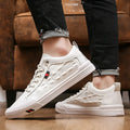 White men's casual sneakers with lace-up closure, rubber sole, and round toe cap on a plain background