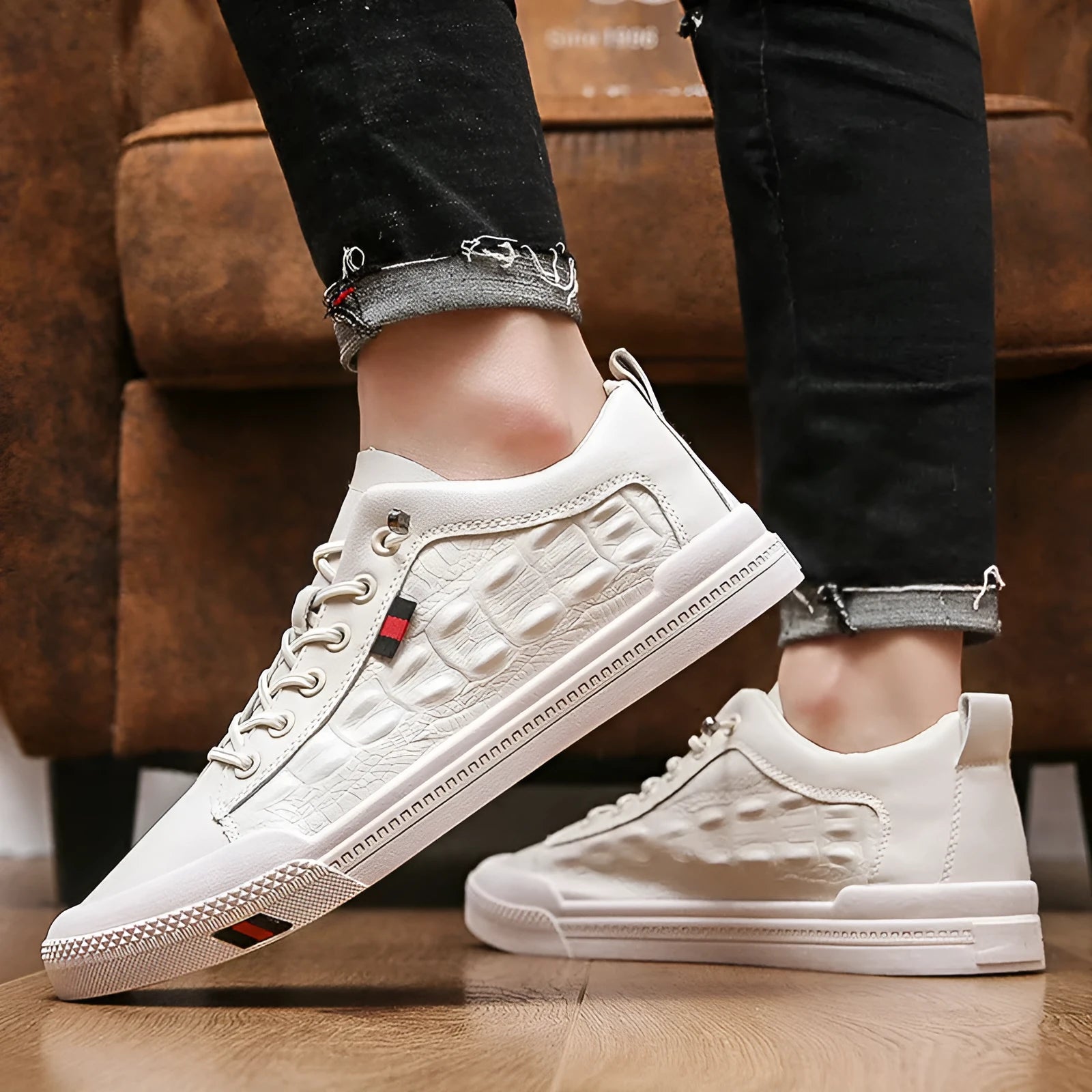White men's casual sneakers with lace-up closure, rubber sole, and round toe cap on a plain background