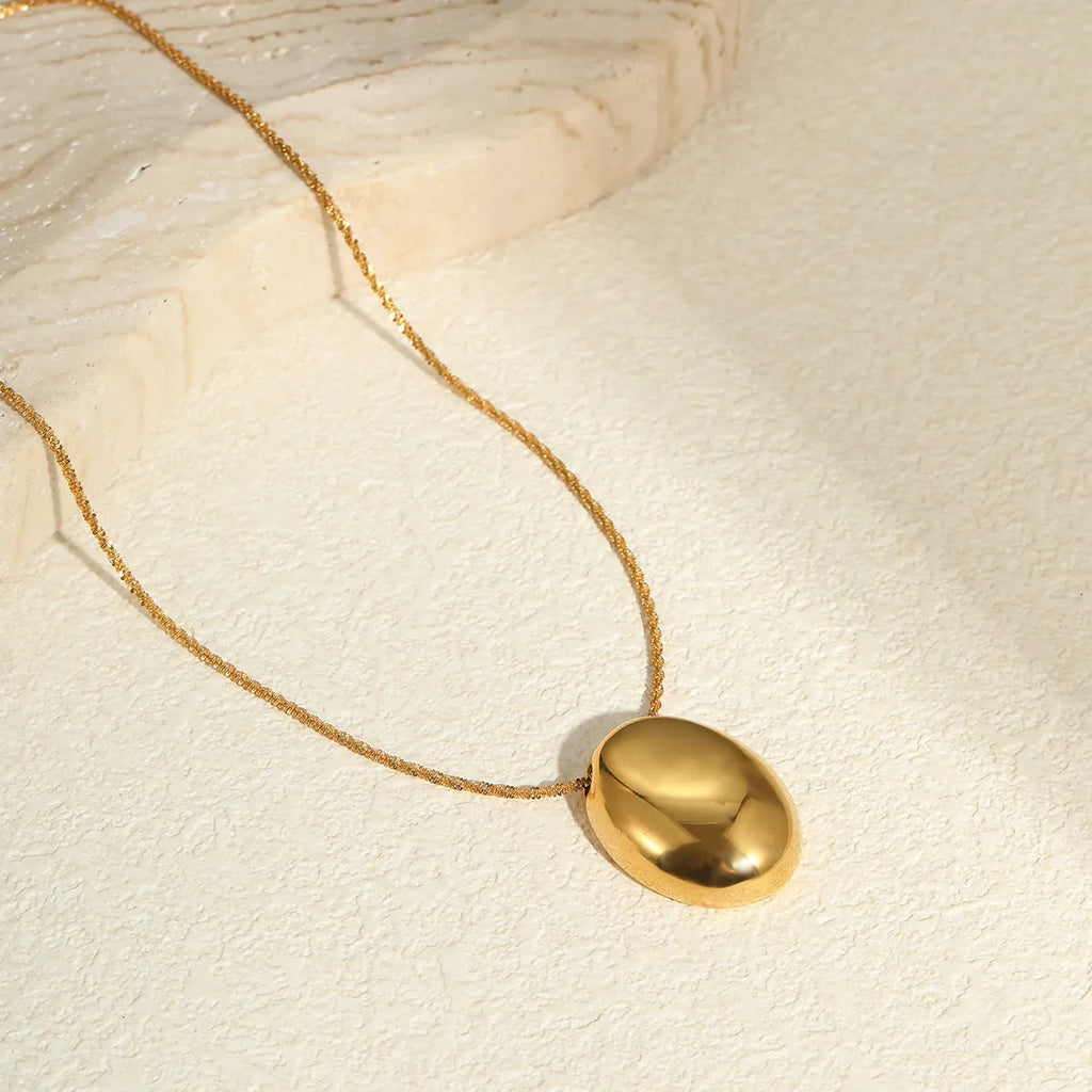 18K gold-plated geometric pendant on an adjustable stainless steel necklace chain.