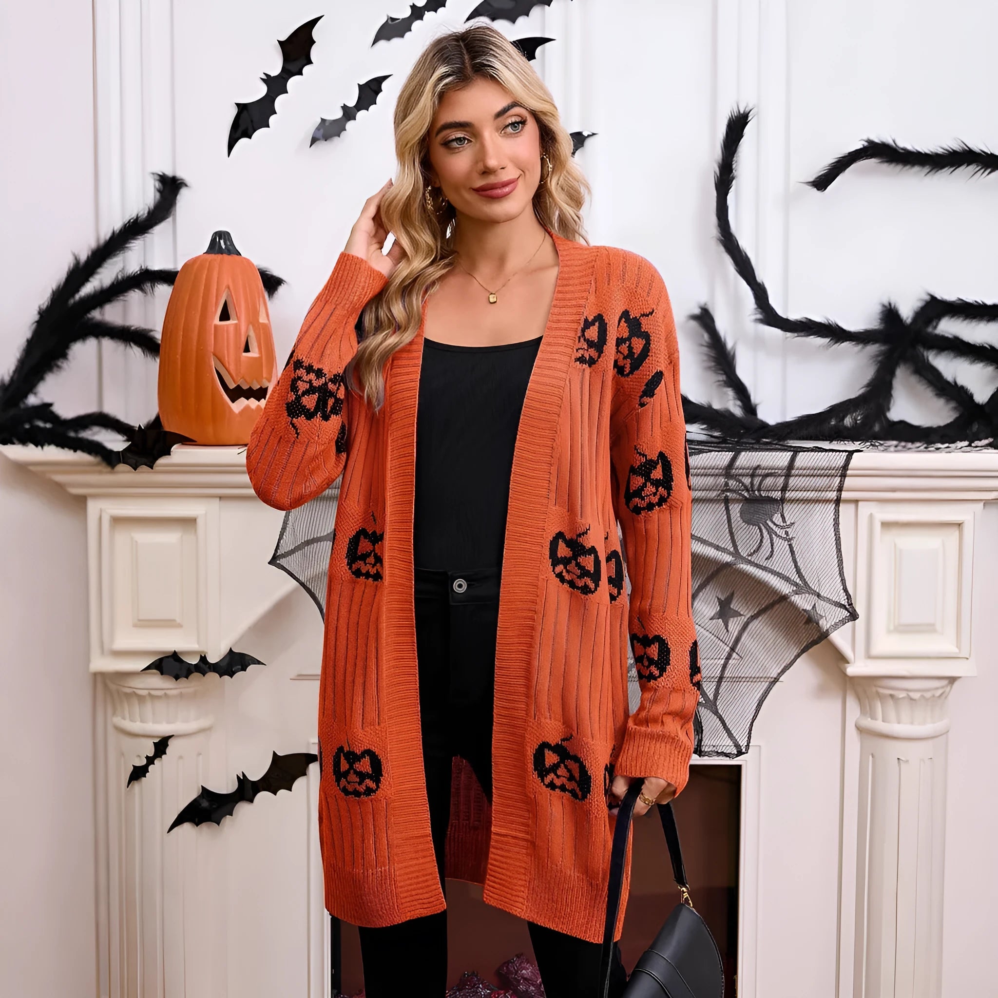 Women's black Halloween cardigan with orange pumpkin head jacquard knitted pattern, medium length straight cut design