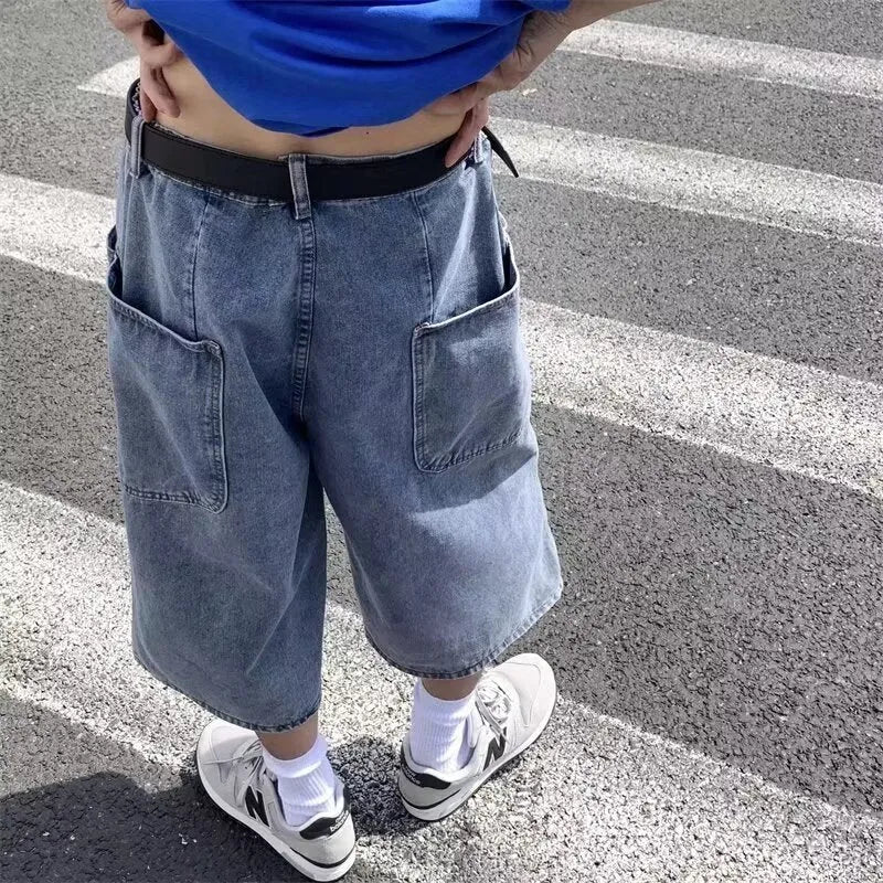 Men's high-waisted, cropped blue denim-style pirate shorts with a straight leg and zipper fly.