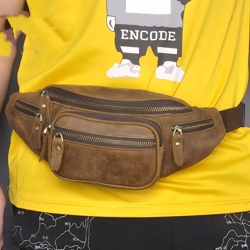 Brown leather shoulder messenger bag with single strap and large main compartment.