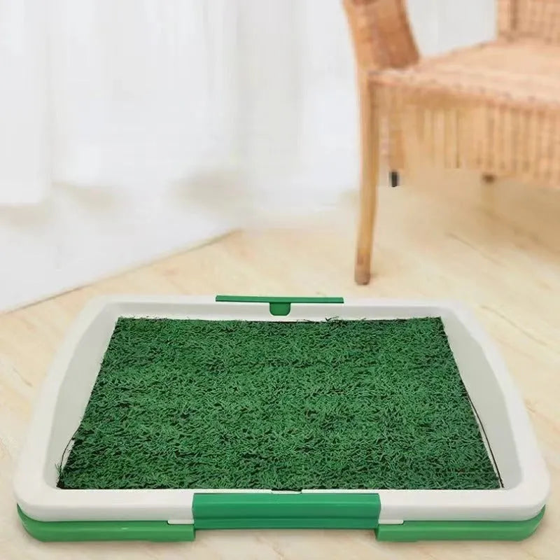 Green artificial grass indoor dog potty training tray with removable base, dimensions 50cm by 60cm.