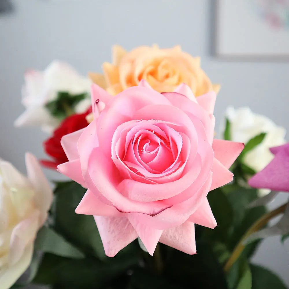 Artificial silk flower bouquet measuring approximately 42cm long with 8.5cm flower heads in multiple colour options