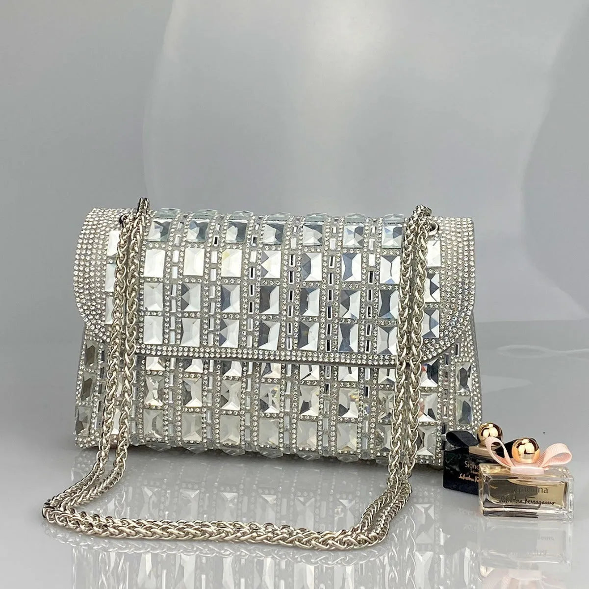 Shiny glass rhinestone chain clutch handbag in silver with open pocket and chain strap