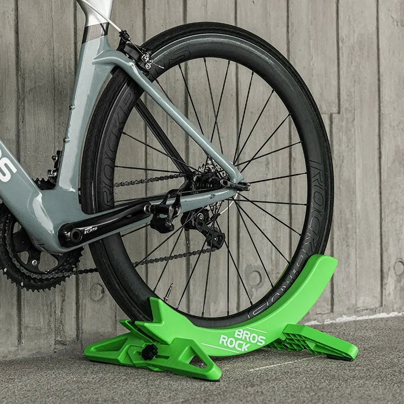 Black and green ABS wall-mounted bike parking rack holder for road and mountain bikes with universal fit