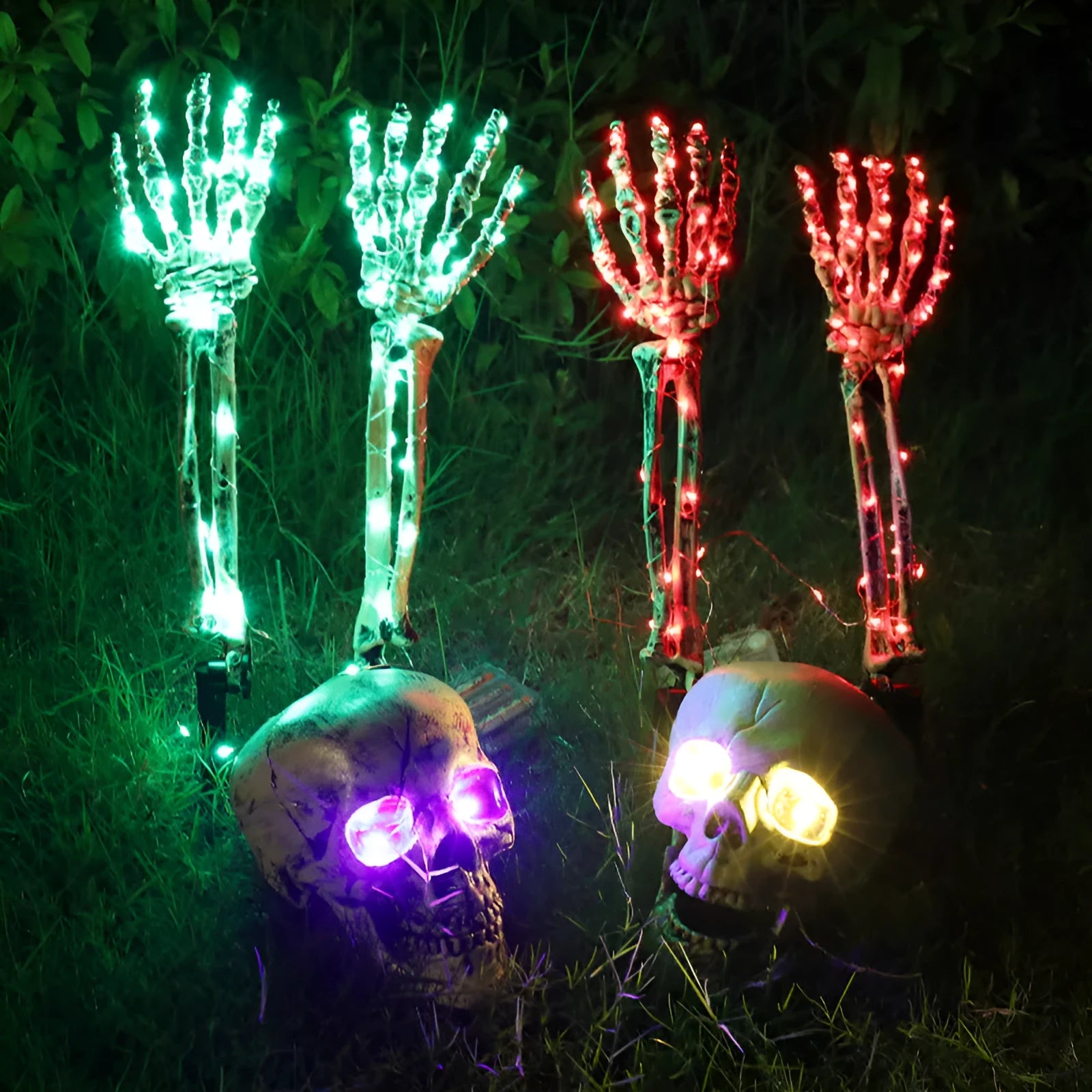 Halloween LED skeleton arm ground plug lamp in purple with LED glow placed on grass
