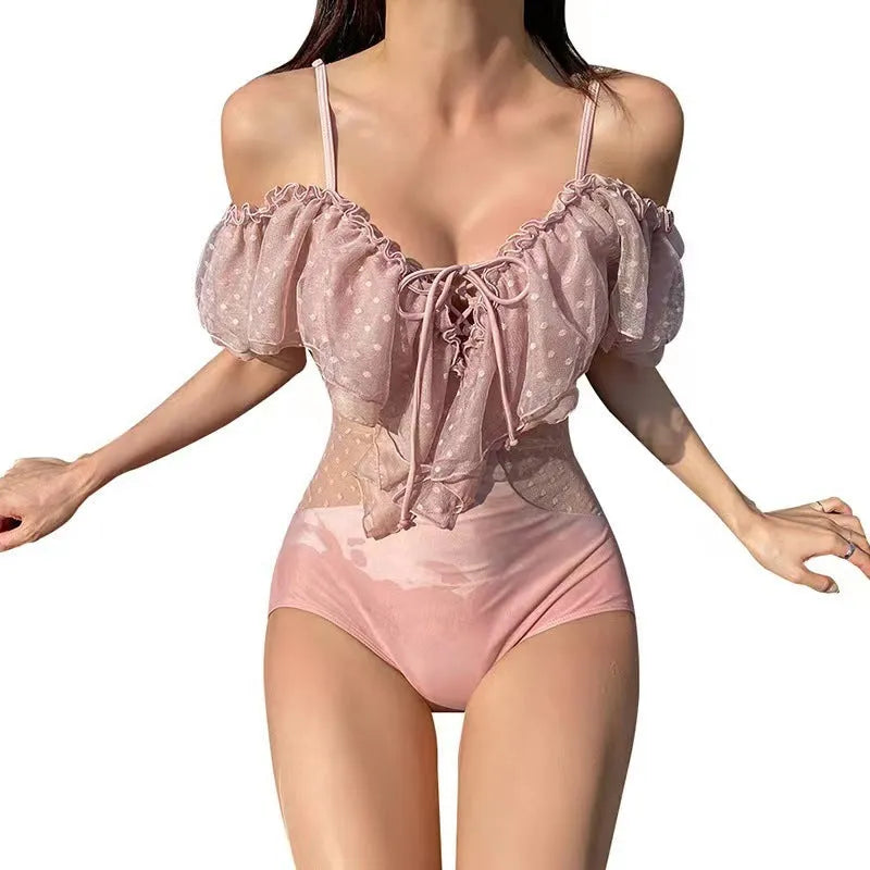 Pink solid colour nylon one piece women's swimsuit for swimming and wading, front view.