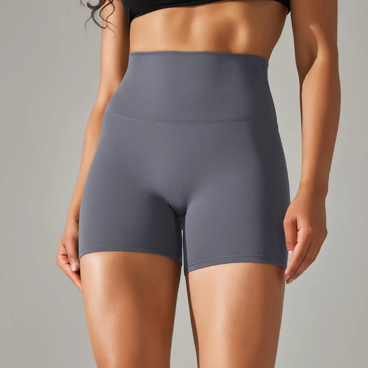 High waist hip lift fitness pants for women in black with belly control and moisture wicking