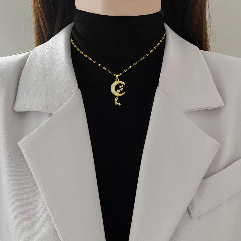 Stainless steel necklace with moon pendant and geometric tassel elements
