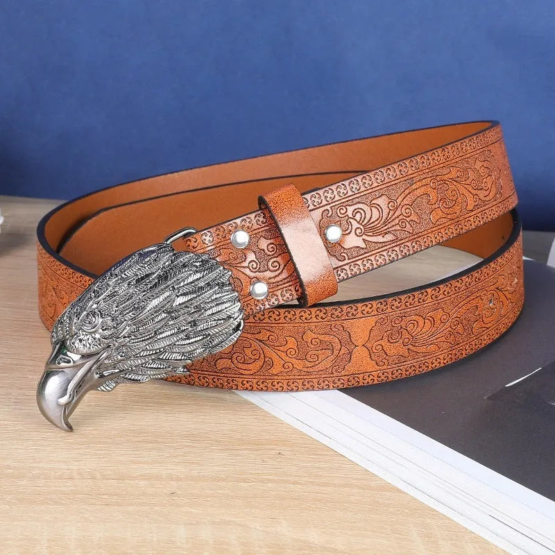 Men's brown leather belt with detailed cow head alloy buckle and pin fastening mechanism