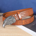 Men's brown leather belt with detailed cow head alloy buckle and pin fastening mechanism