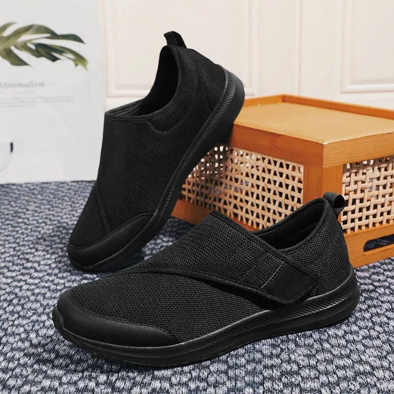 Outdoor mountaineering walking shoes with mesh upper, Velcro closure, and round toe in black
