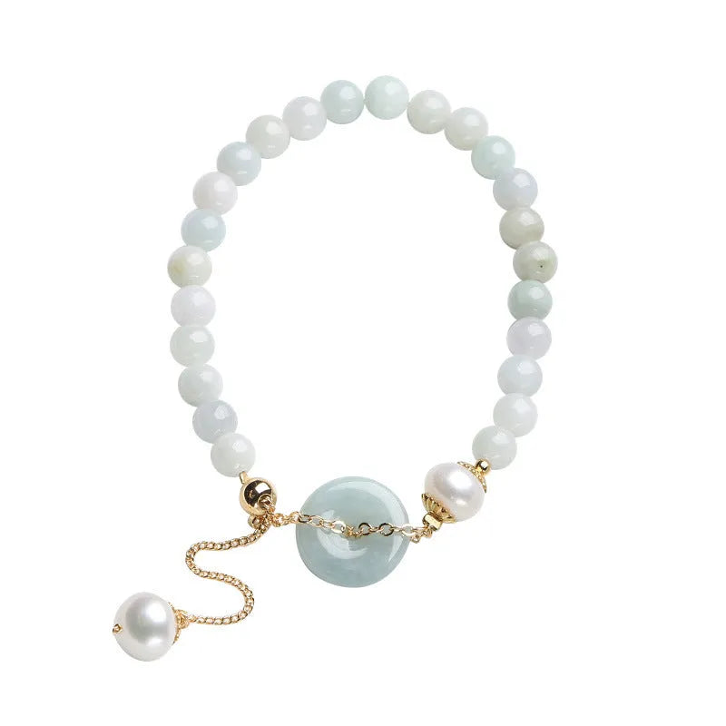 Traditional jade bracelet with peace buckle charm and pearl accents for women