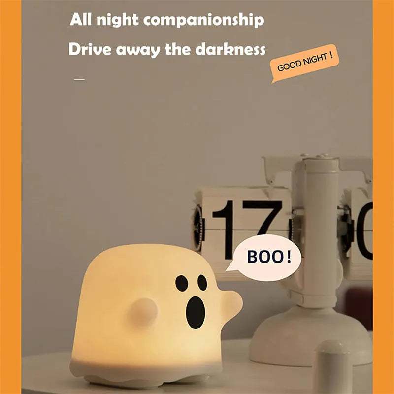 Silicone night light LED touch sensor lamp for kids bedroom in pink, showing soft glow on a bedside table