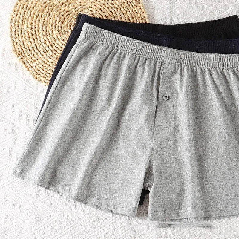 Men's high waist cotton boxer shorts in loose fitting design showing solid colour options