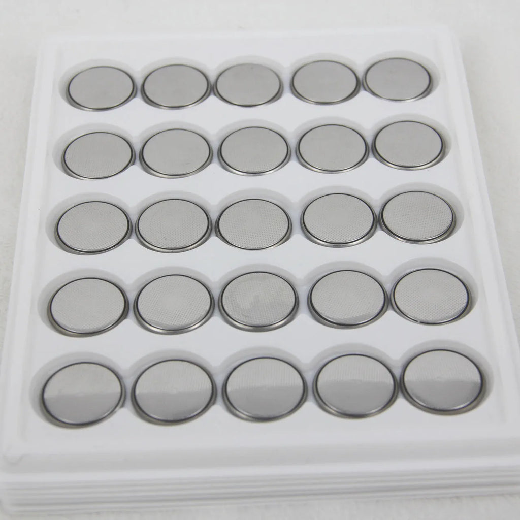 3V button battery CR2032 alkaline cell 20mm diameter on white background