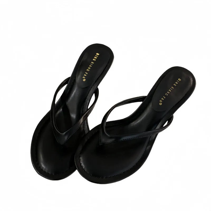 Women's open-toed stiletto sandals with flat head, rubber sole, in classic black, side view
