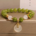 Natural stone green tourmaline women's bracelet with four-leaf clover safety buckle in New Chinese style drop shape geometric design green colour