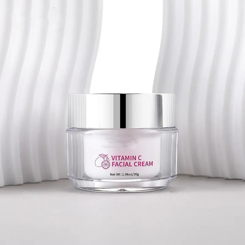 Square white jar of vitamin C face cream, 30g net content, showing product dimensions.