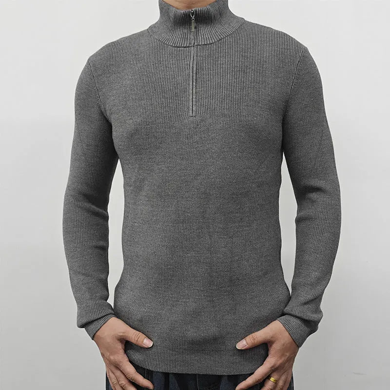 Men's black half-turtleneck zip-up pullover sweater with long sleeves on a model.