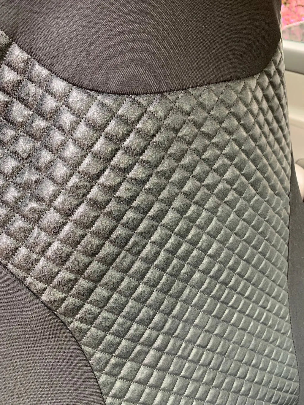 Black quilted universal car seat cover with plastic hook fastening system