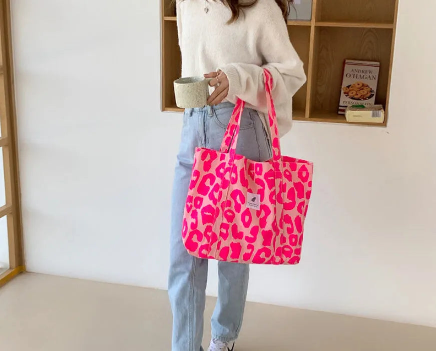 Large capacity Oxford cloth shoulder bag for women with three-dimensional outer pocket, available in pink, black, sapphire blue, and colour options.