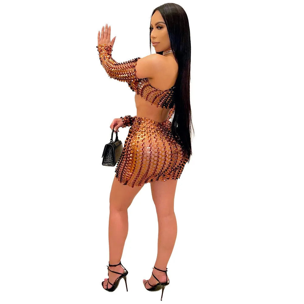 Women's black hollow-out net two-piece dress set featuring a sleeveless top and short skirt on a hanger.
