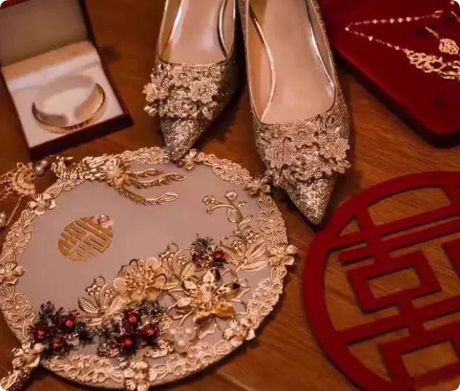 Champagne coloured bridal shoes with crystal rhinestones, pointed toe, and court heel.