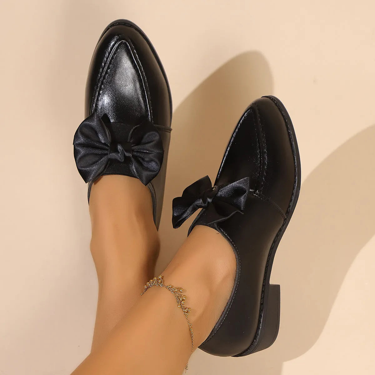Women's British-style leather shoes with decorative bow detailing on PU upper and rubber sole