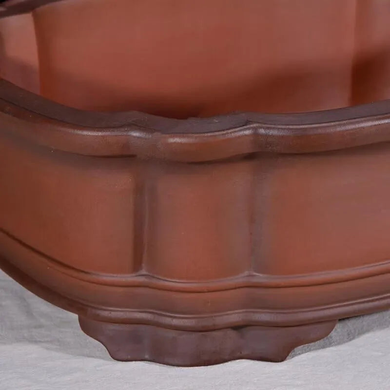 Large antique Chinese style purple clay flower pot with tree stump design and decorative botanical relief