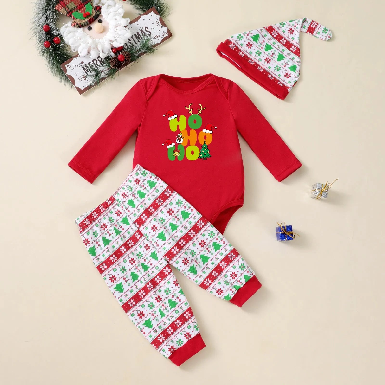 Baby Christmas tree print long-sleeve bodysuit, pants, and hat three-piece outfit on a white background