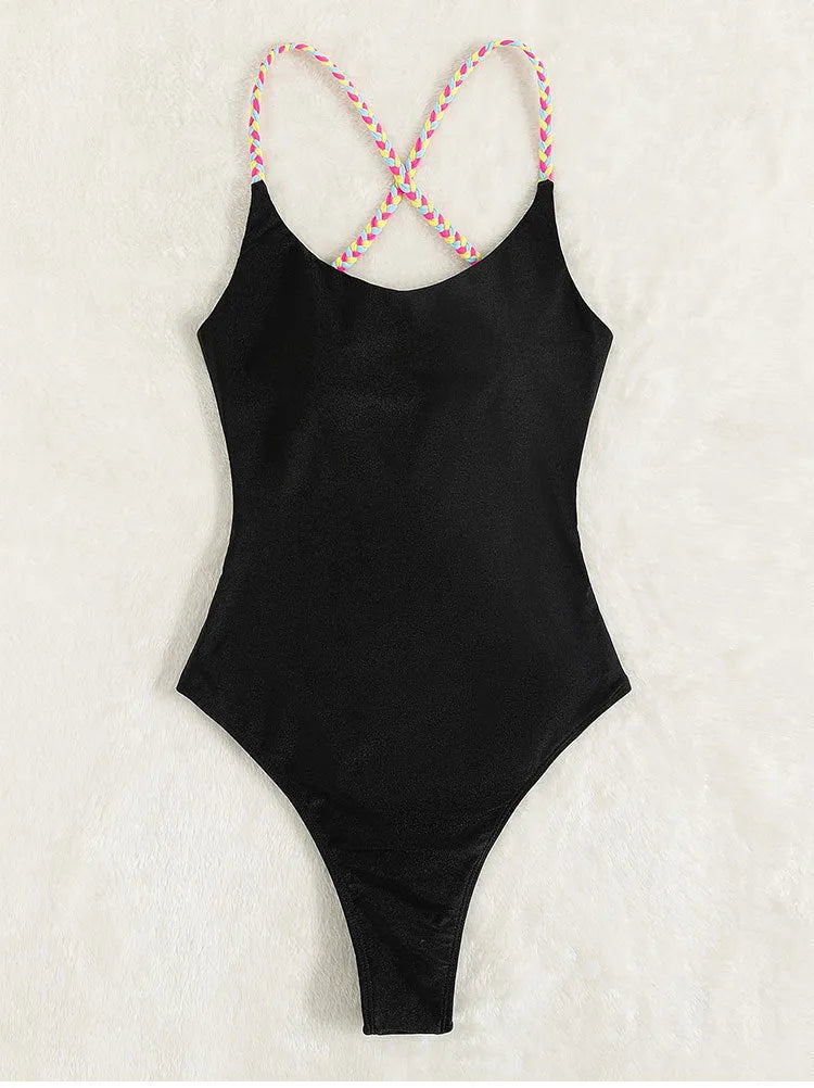 Solid black backless one-piece nylon swimsuit for women with tight fit and high-cut leg