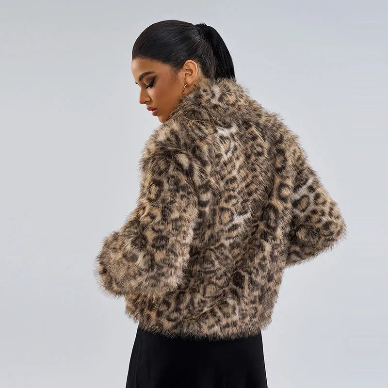 Women's leopard print coat with a buckle lapel closure and regular sleeves.