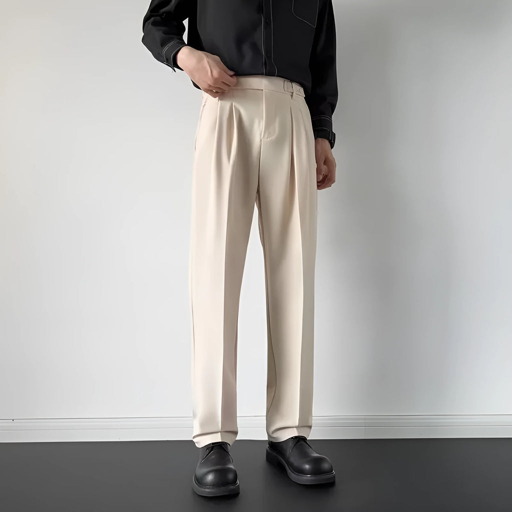 Men's apricot and black straight-leg loose-fit suit trousers on a hanger.